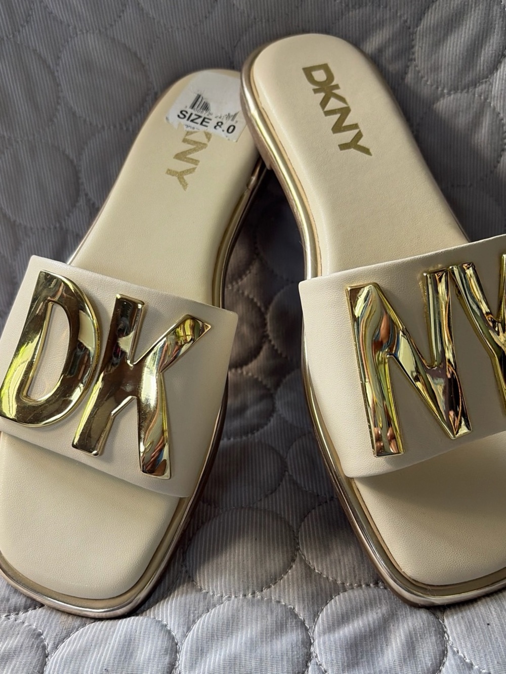 DKNY Cream Slide Mules with Gold Logo Accent